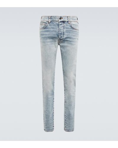 Amiri Low-Rise Skinny Jeans Stack - Blau