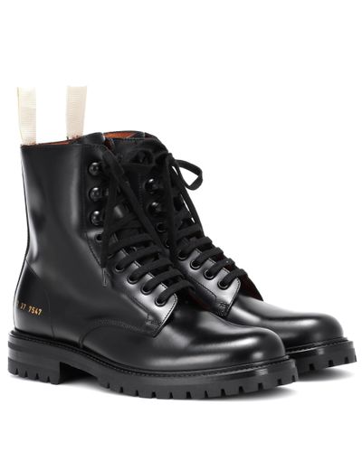 woman by common projects combat boots
