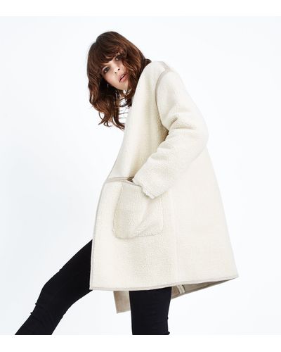 cream collarless coat