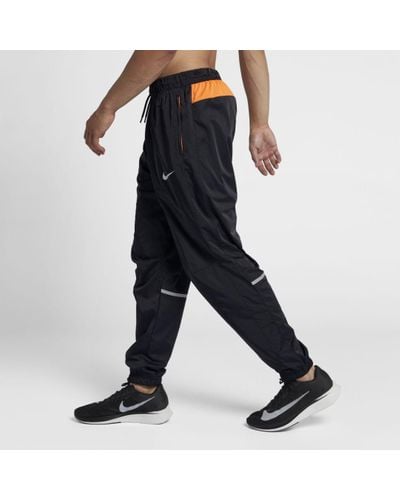 nike track pants reflective