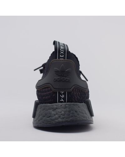 nmd r1 triple black stlt