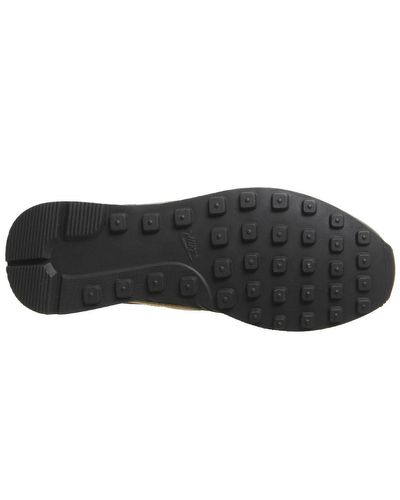 nike black and gold internationalist trainers