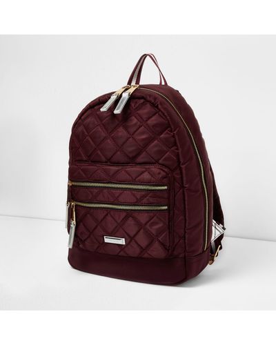 red quilted backpack