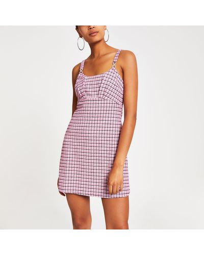 pink checkered pinafore