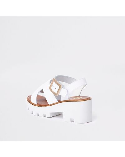 white chunky flip flops