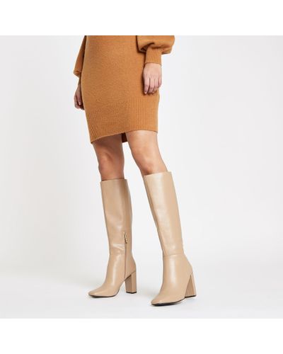 cream knee high boots
