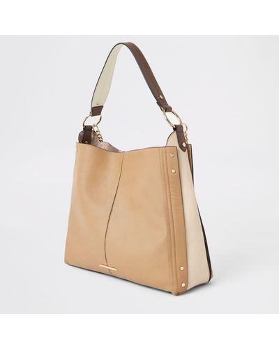 river island black oversized ring front slouch bag
