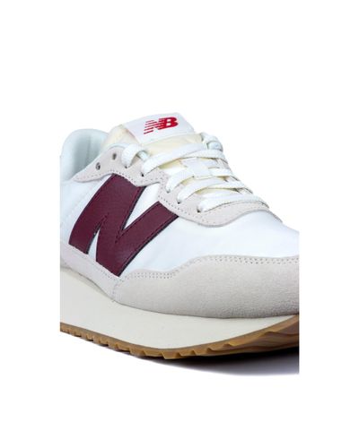 new balance 237 trainers in off white and burgundy
