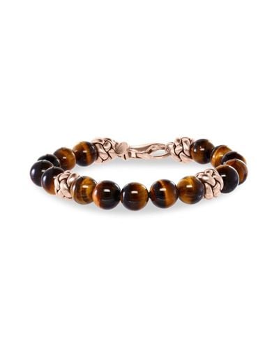 Onyx and Tiger’s eye bracelet with rose gold plated charms.