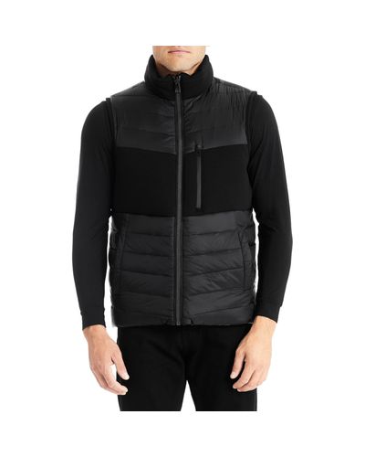 tumi down vest