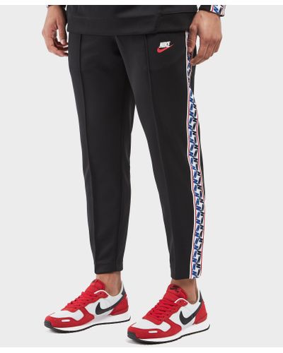 Nike Synthetic Taped Poly Track Pants in Black for Men | Lyst UK