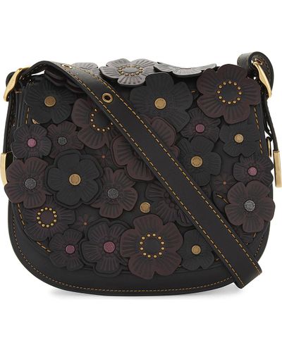 coach tea rose saddle bolsa