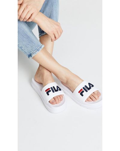 white fila slides