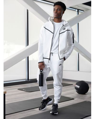 grey and white nike tech