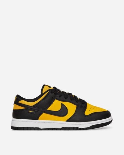 Nike Dunk Low Trainers Black / University Gold - Yellow