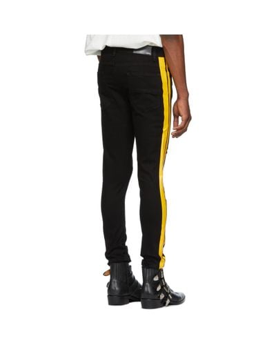 amiri jeans black and yellow