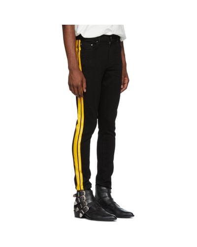 purple yellow amiri jeans