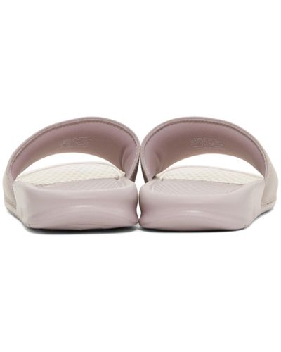 nike benassi slides pink and black
