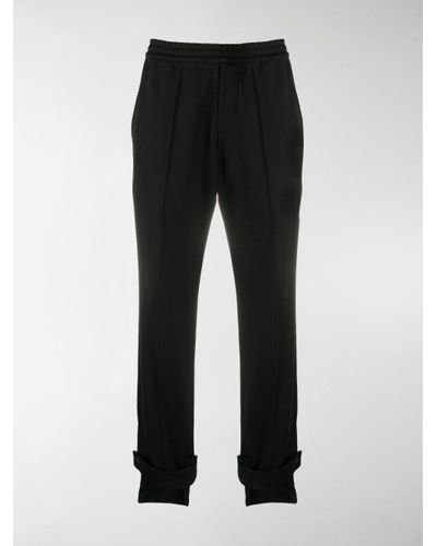 black cuffed track pants