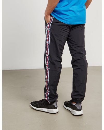 champion retro tracksuit bottoms with logo taping Off 54% -  wuuproduction.com