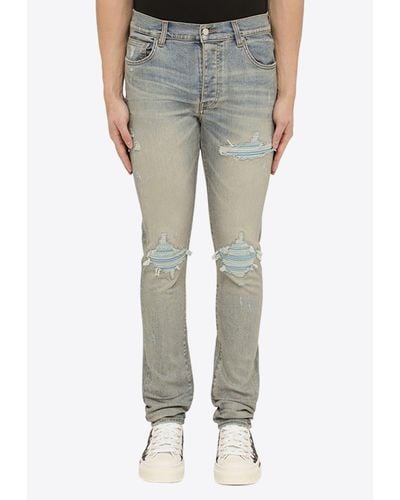 Amiri Washed-Out Distressed Skinny Jeans - Gray