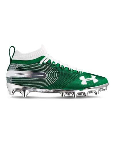 green and white football cleats