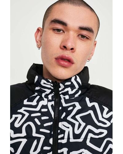 element x keith haring reversible puffer jacket in black