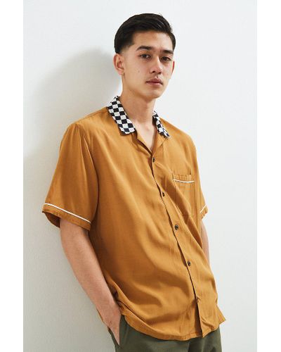 dark yellow button up shirt