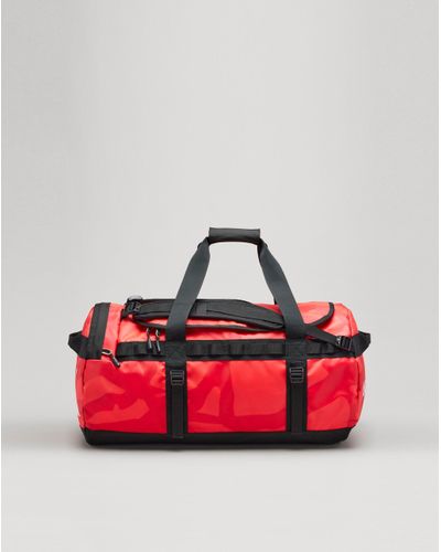 The North Face Kaws X Basecamp Duffle M in Red for Men | Lyst