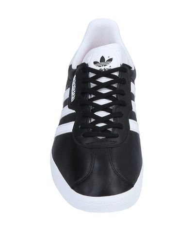 all black low top adidas