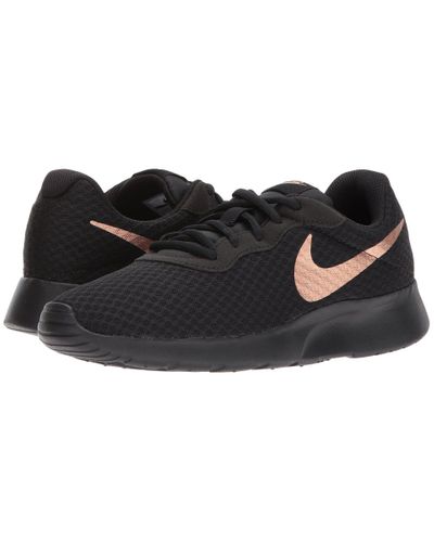 nike tanjun womens black and bronze
