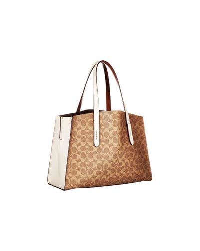 coach charlie carryall in signature canvas