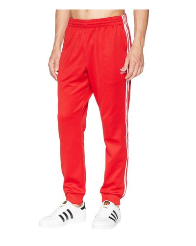 scarlet red adidas pants