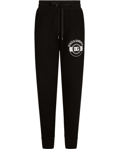 Dolce & Gabbana Pantalon de jogging en jersey à imprimé logo DG - Noir