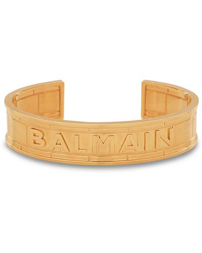 Balmain Bracelet manchette en laiton doré avec logo - Métallisé