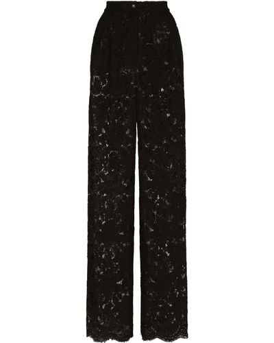 Dolce & Gabbana Pantalon flare en dentelle stretch à logo - Noir