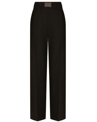 Dolce & Gabbana Flared Wool Trousers With Logo Tag - Black