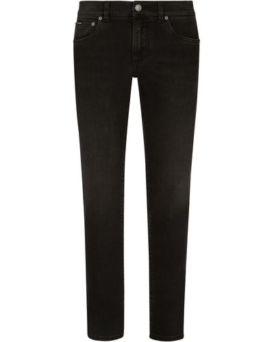 Dolce & Gabbana Stretch-Jeans Skinny aus grauem Washed-Denim - Schwarz