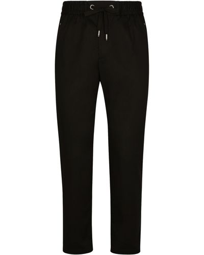 Dolce & Gabbana Pantalon de jogging en coton stretch avec étiquette - Noir