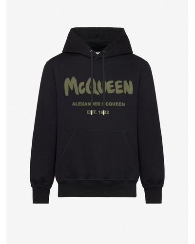 Alexander McQueen Kapuzensweatshirt mit mcqueen-graffiti-motiv - Schwarz