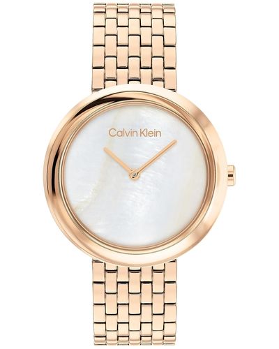 Calvin Klein , Twisted Bezel Vrouwen Witte Parelmoer Wijzerplaat, Ionische Vergulde Anjer Goud Stalen Horloge - 25200322 - Metallic