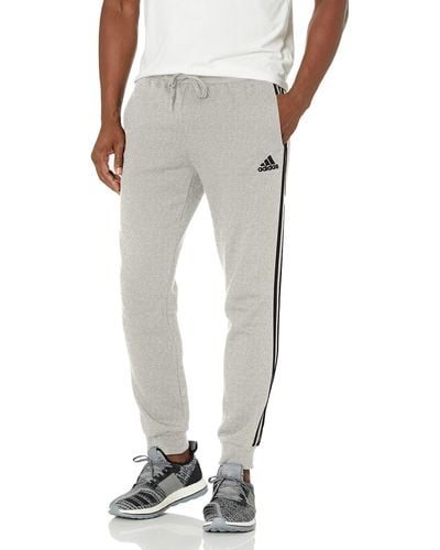 adidas Size Essentials Fleece Tapered Cuff 3-Stripes Pants - Grigio