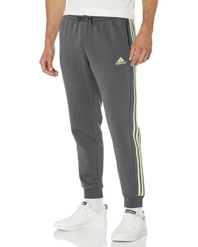 adidas Essentials Fleece Tapered Cuffed 3-stripes Pants - Gray