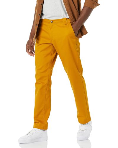Amazon Essentials Pantalón de Trabajo Elástico de Corte Recto y Resistente a Las chas y Arrugas Hombre - Amarillo