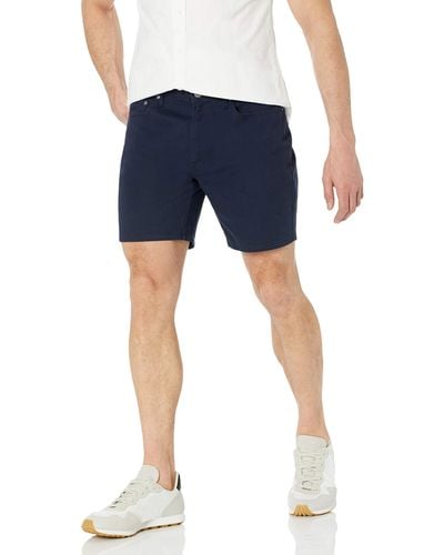 Amazon Essentials Pantaloncini elasticizzati con cuciture interne vestibilità aderente interno gamba 18 cm Uomo - Blu