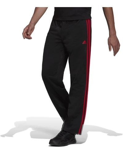 adidas Essentials Pantalon de survêtement pour homme avec ourlet ouvert 3 bandes - Noir