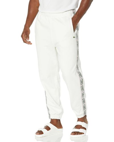 Lacoste Relaxed Fit Adjustable Waist Sweatpants W Tennis Word Taping Down The Legs - White