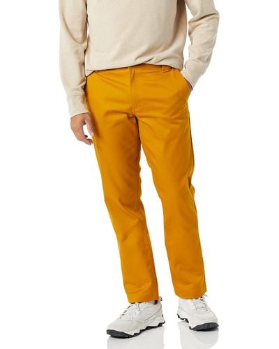 Amazon Essentials Pantalón de Trabajo Elástico de Corte Ajustado y Resistente a Las chas y Arrugas Hombre - Amarillo