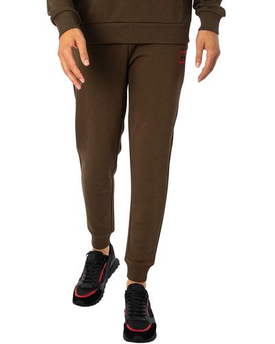 HUGO Dyssop Jogginghose aus Baumwoll-Terry mit rot eingerahmtem Logo Dunkelgrün XS - Braun