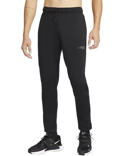 Nike Pantalon fuselé en polaire Dri-Fit Q5 pour homme - Noir